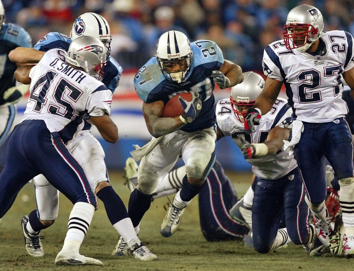 FILE - In this Dec. 16, 2002 file photo, Tennessee Titans running back Eddie George (27) finds a hole in the New England Patriots' line in the third quarter of a football game in Nashville, Tenn. George is one of many pros who become entrepreneurs after their playing days were over. (AP Photo/John Russell, File)