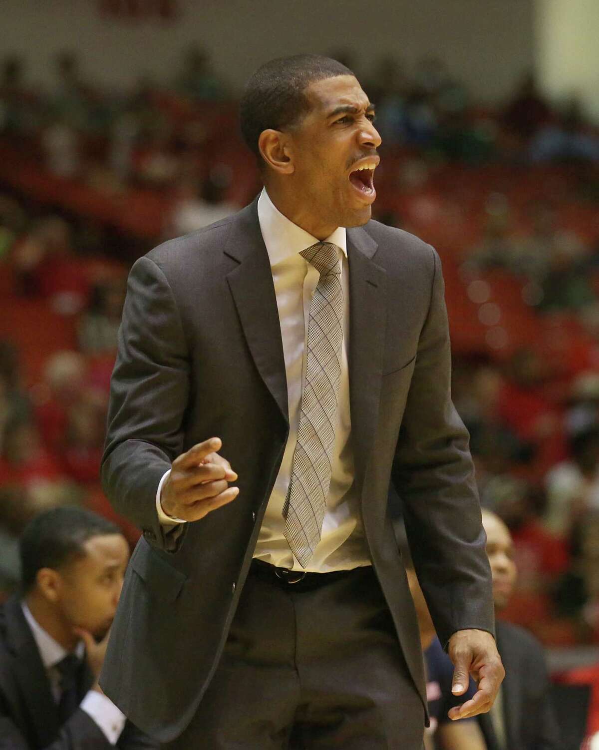 Connecticut Huskies head coach Kevin Ollie argues a call while playing the Houston Cougars in the first half in a NCAA basketball game on Sunday, February 1, 2015 at Hofheinz Pavilion in Houston, TX.