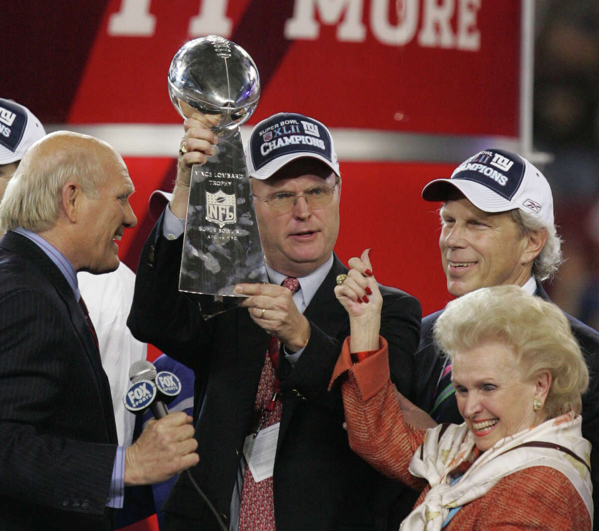 FILE - In this Sunday, Feb. 3, 2008, file photo, New York Giants owner John Mara holds the trophy with chairman Steve Tisch, back right, and Ann Mara after the Giants defeated the New England Patriots 17-14 to win Super Bowl XLII football game at University of Phoenix Stadium on in Glendale, Ariz. Ann Mara, the matriarch of the NFL's New York Giants for the past 60 years, died Sunday, Feb. 1, 2015. She was 85. (AP Photo/Chris O'Meara, File) ORG XMIT: NY124