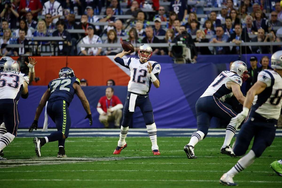 New England Patriots quarterback Tom Brady (12) passes the ball against the Seattle Seahawks during the first half of NFL Super Bowl XLIX football game Sunday, Feb. 1, 2015, in Glendale, Ariz. (AP Photo/Matt York)