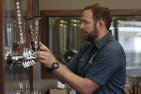 Jason Ard, owner of Branchline Brewing Company, works on newly installed equipment at his place of business Nov. 5, 2012. Branchline Brewing is a production brewery that focuses on craft beers using local and regional ingredients when possible.