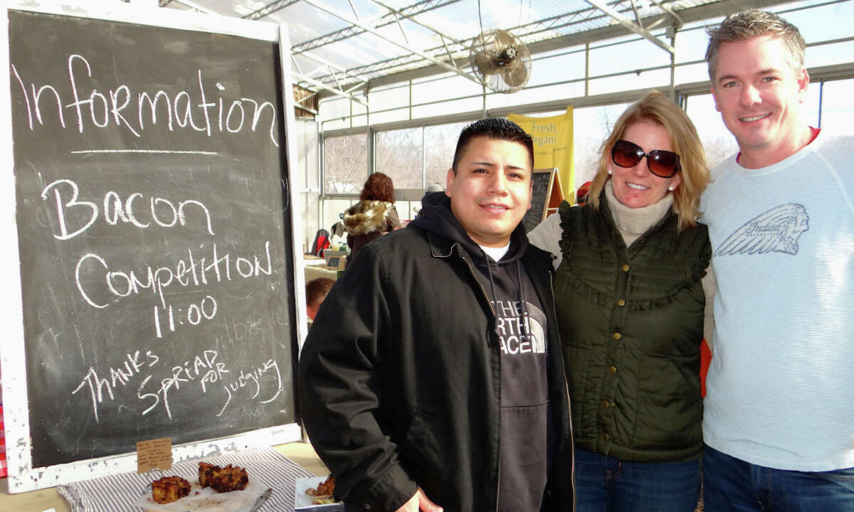 Chef Carlos Baez and Chris Hickey, partners at The Spread restaurant in Norwalk, flank Lori Cochran, executive director of the Westport Farmers Market, where Baez and Hickey judged a bacon recipe contest Saturday.