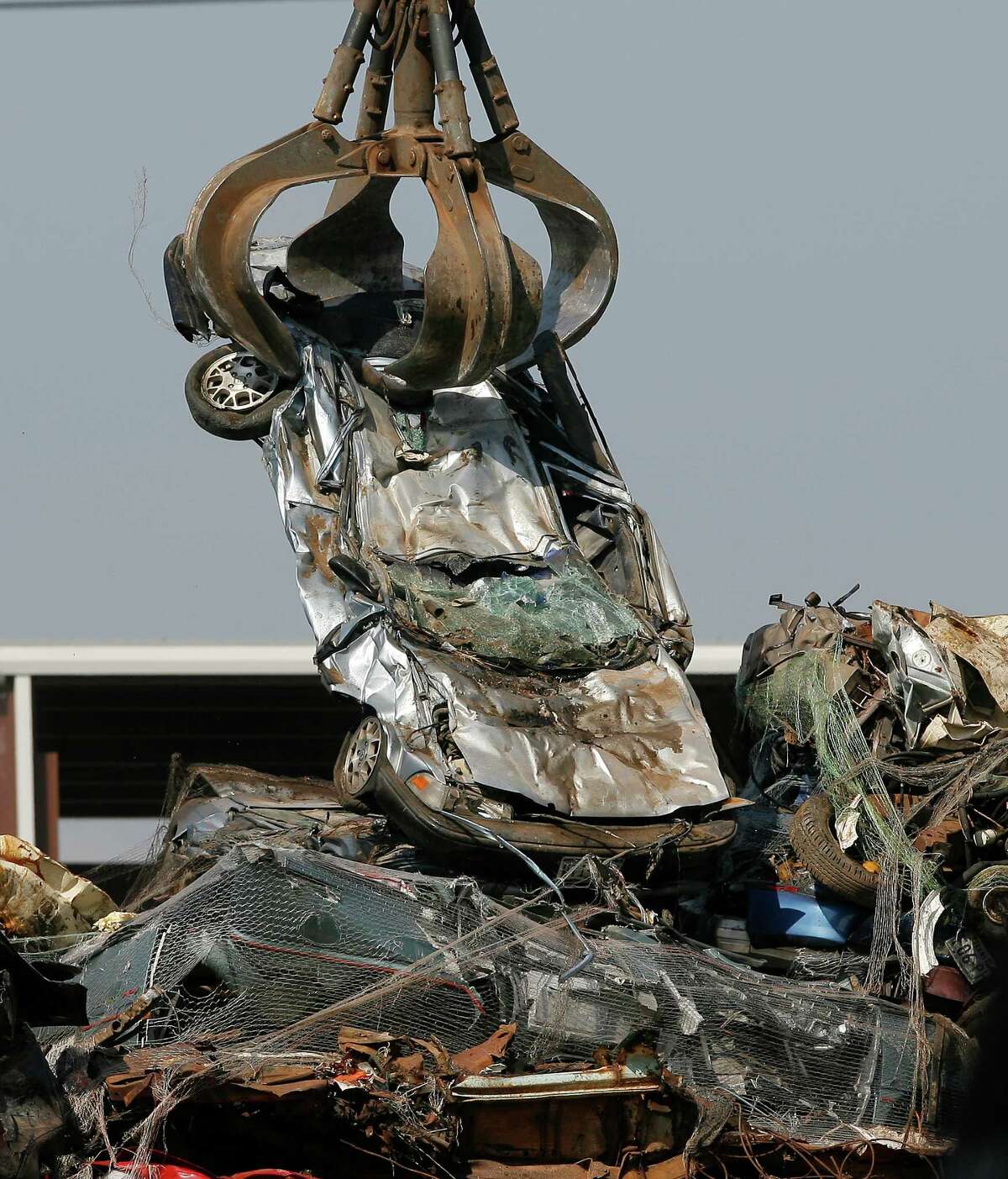 How many tons of metal (including iron based metals and others) were recycled in Texas in 2013?