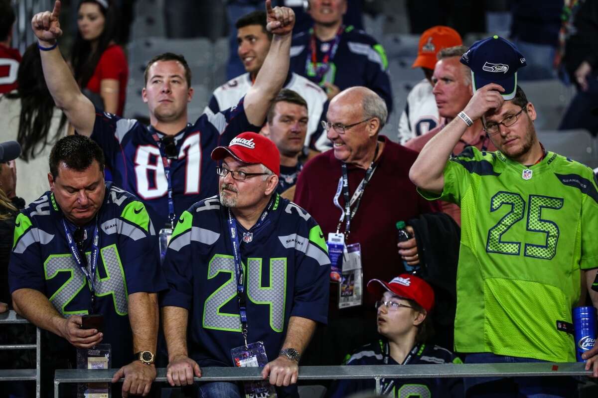 Seahawks fans react to the end of the game against the New England Patriots during Super Bowl XLIX at University of Phoenix Stadium. The Seahawks lost to the Patriots 28 to 24. Photographed on Sunday, February 1, 2015. (Joshua Trujillo, seattlepi.com)