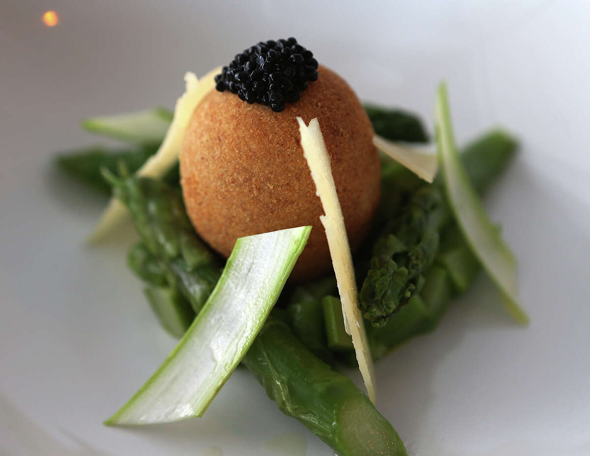 The soft boil breaded egg at Saveurs 209 comes with seasonal vegetables.