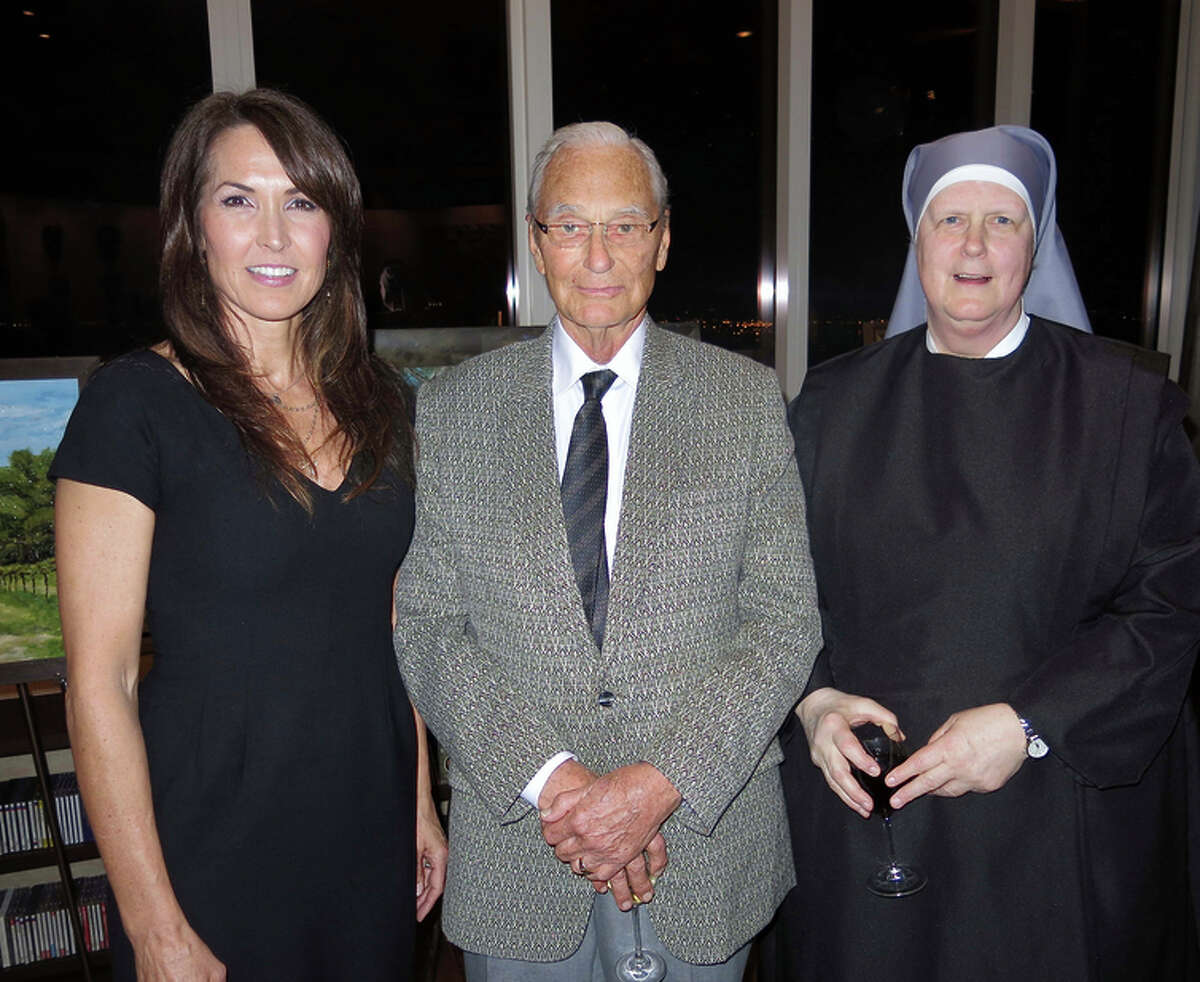 Artist Susan Williams Schneider (left) with Tom Perkins and Sister Theresa Robertson.