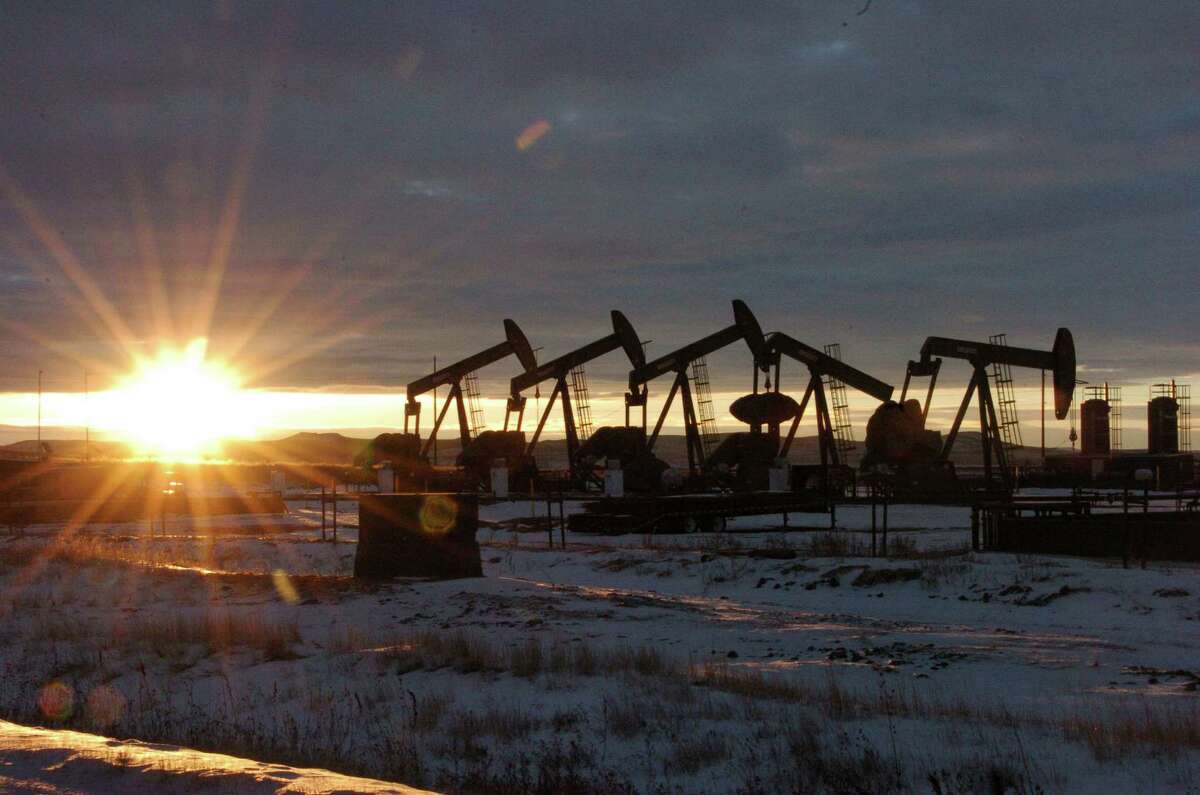 Pump jacks bring oil up from wells in North Dakota. (AP Photo/Matthew Brown)