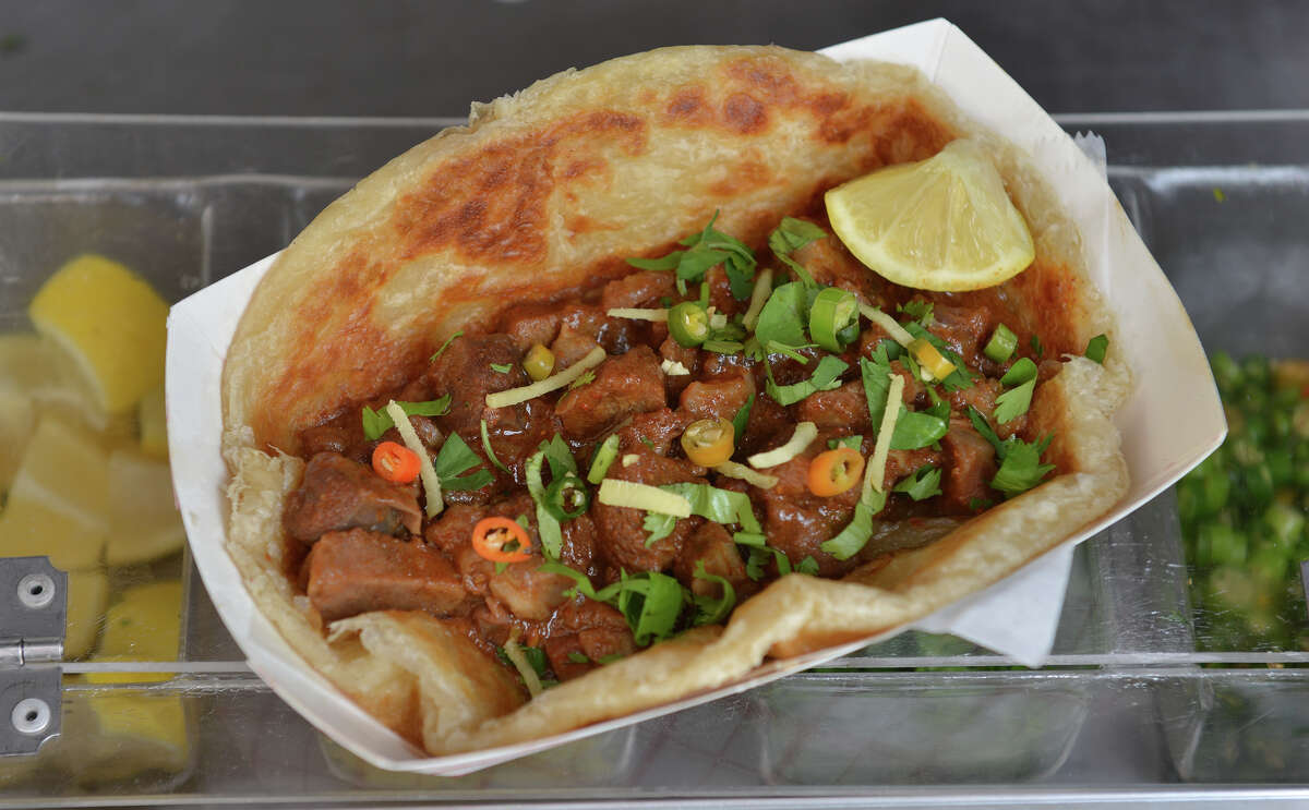 Beef Nihari from the Rickshaw Stop food truck is served in a Pakistani flatbread.