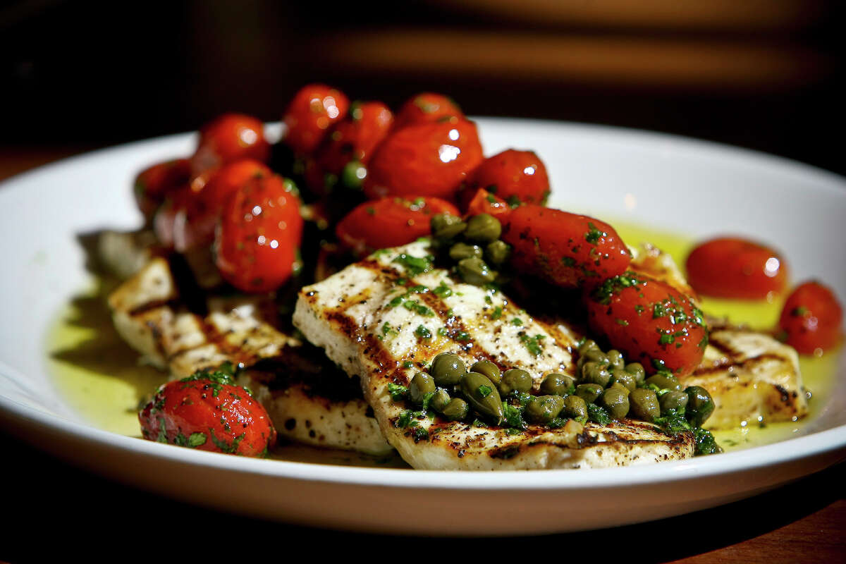 Grilled Swordfish with Capers and Tomato Confit is seen Tre Trattoria.