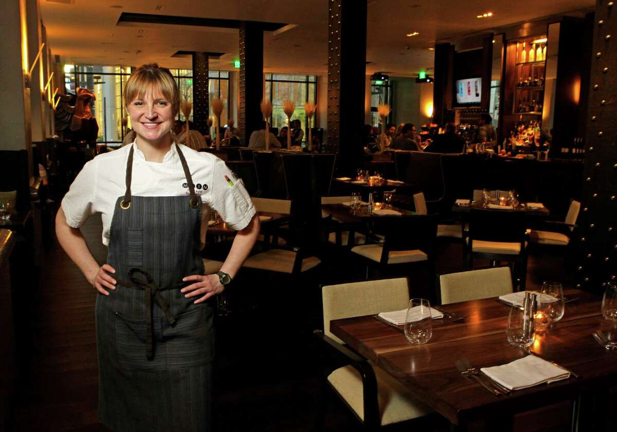 Chef Erin Smith poses in the Main Kitchen restaurant at the JW Marriott Houston Downtown.
