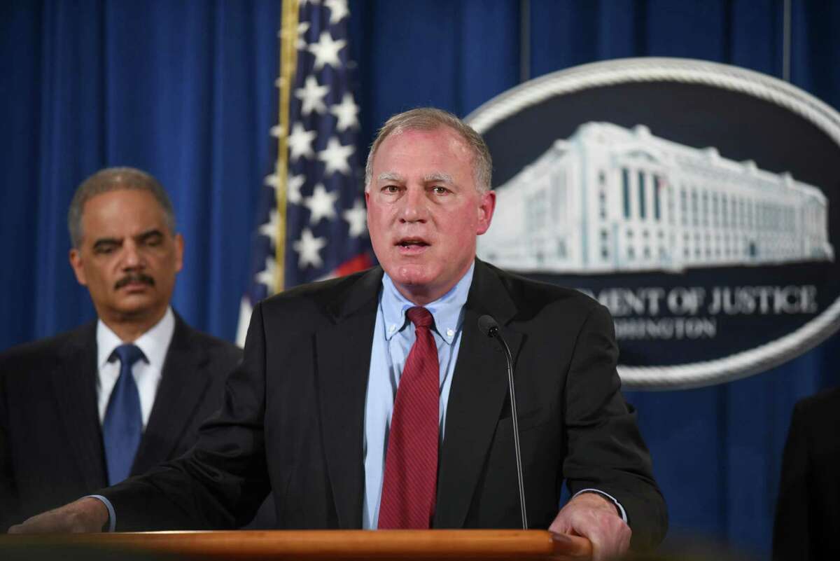 Connecticut Attorney General George Jepsen speaks at a news conference with Attorney General Eric Holder at the Department of Justice on Tuesday, Feb. 3, 2015 in Washington. Standard & Poor's is paying about $1.38 billion to settle government allegations that it knowingly inflated its ratings of risky mortgage investments that helped trigger the financial crisis, the Justice Department announced Tuesday. (AP Photo/Kevin Wolf)