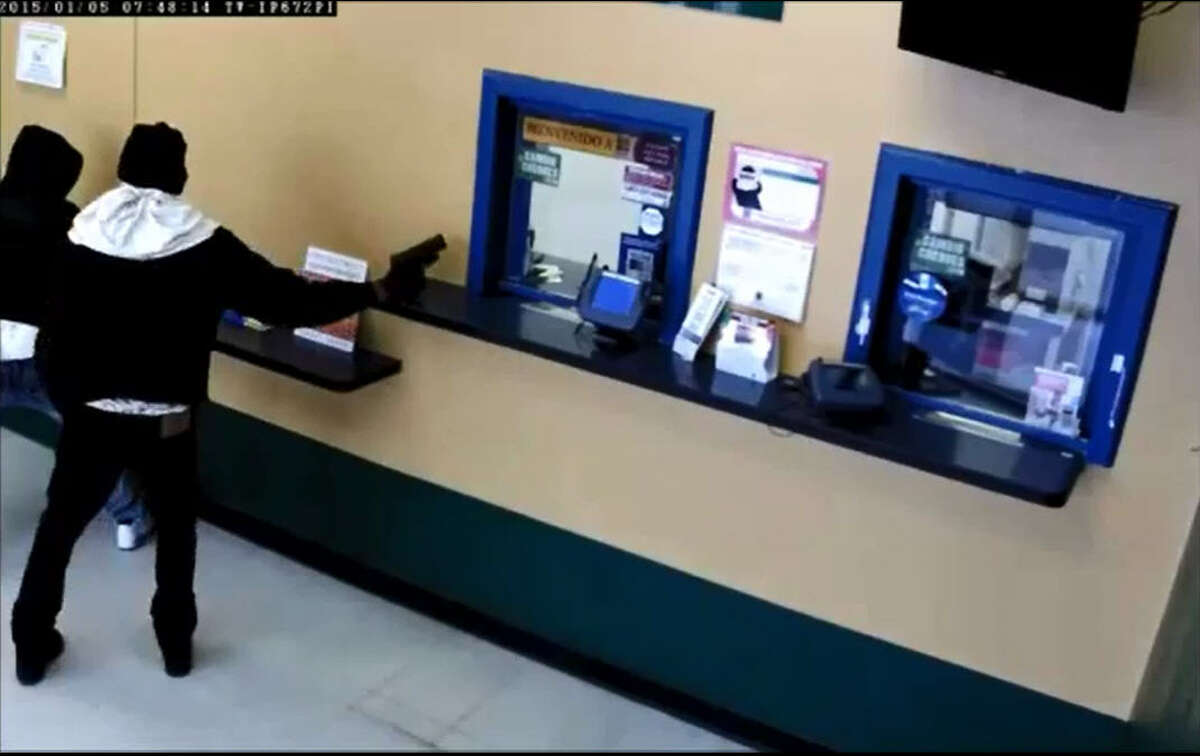 Cash store robbers' latest gimmick Bypass security by climbing into