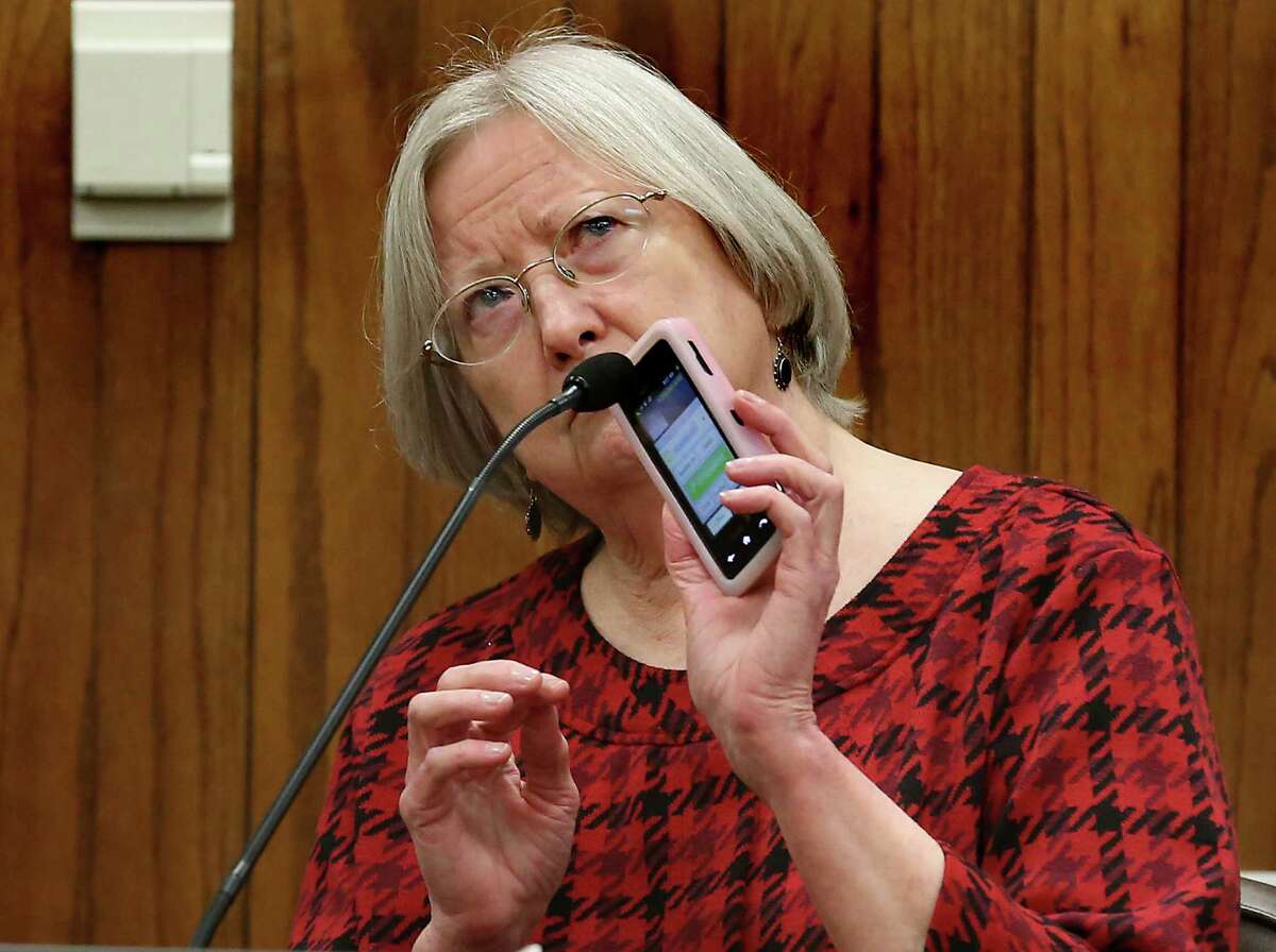 Mary Polensky plays a phone message from R. Tom Roddy on her cellphone during her testimony Thursday. She was the first witness called by Tom Benson’s legal team.