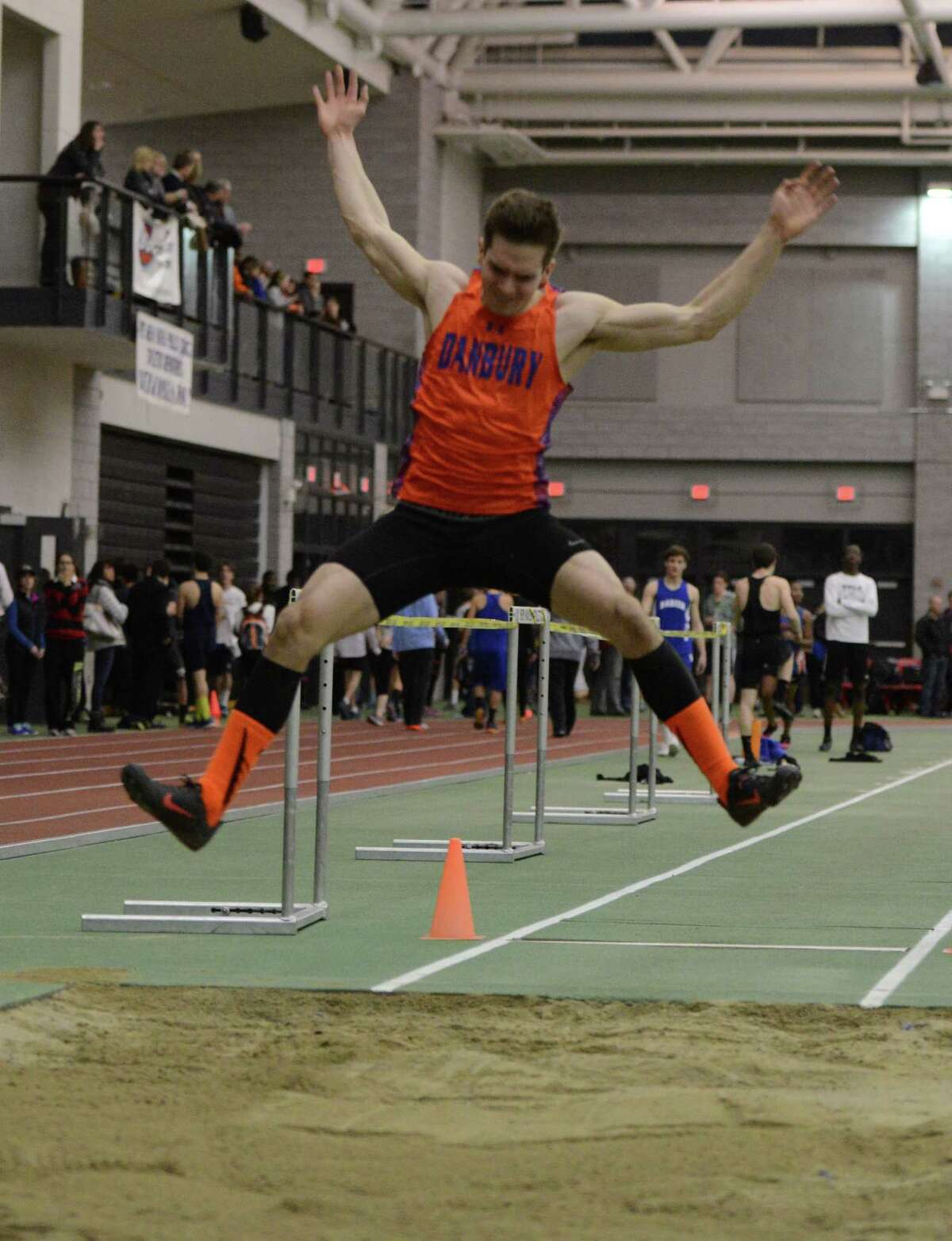 Danbury's Mike Morrow competes in the long jump event Thursday, Feb. 5, 2015, during the FCIAC boys and girls indoor track and field championhsips at the Floyd Little Athletic Center in New Haven, Conn.