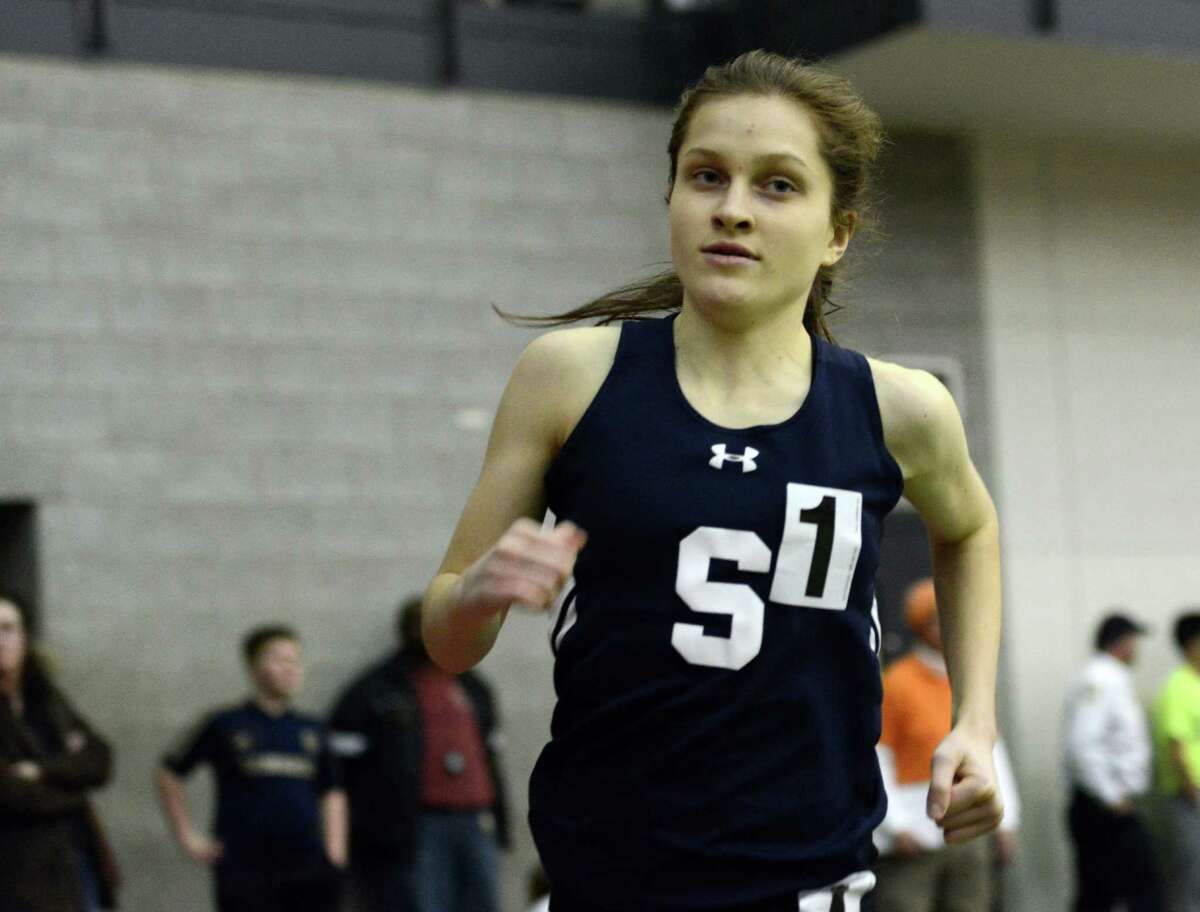 Staples' Hannah DeBalsi leads the way in the 1000 meter race Thursday, Feb. 5, 2015, during the FCIAC boys and girls indoor track and field championhsips at the Floyd Little Athletic Center in New Haven, Conn.