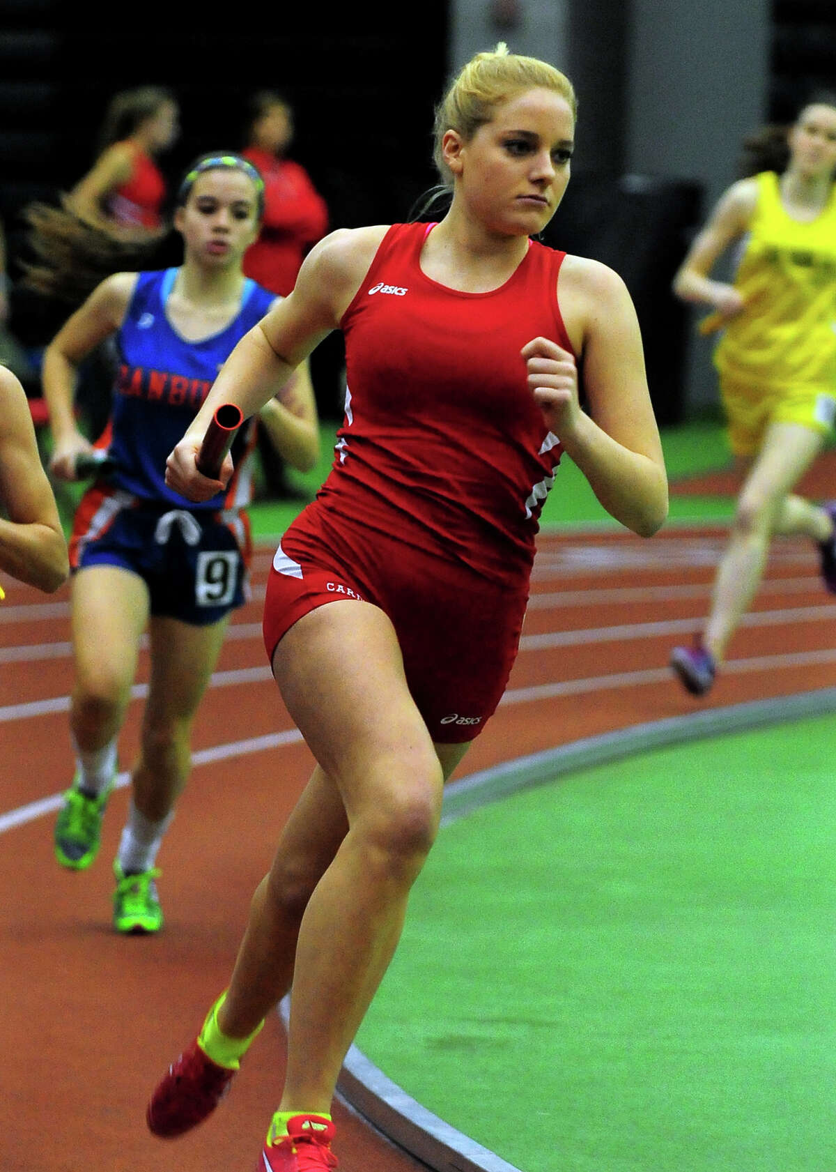 Greenwich's Jenny Goggin competes in a heat of the 4X800 meter relay, during FCIAC track championship action in New Haven, Conn. on Tuesday Feb. 5, 2015.
