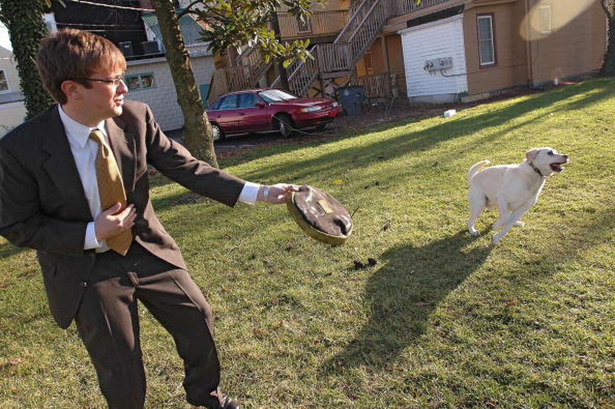 20. Delaware In this photo, John Rediker, an attorney for the investors of The Walt Disney Co., throws a Frisbee to his dog Jack, a yellow Labrador retriever, during some off time from working at the Disney vs Ovitz trial in Georgetown, Delaware, Monday, December 13, 2004.