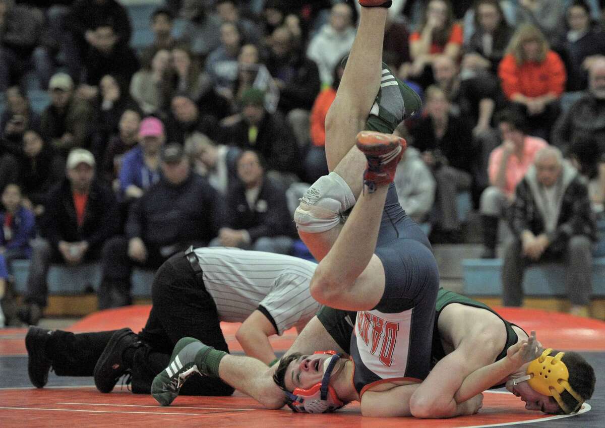 New Milford's Brett Leonard, right, and Danbury's Andrew Marquis wrestle in the 160 pound weight class during the high school wrestling match between New Milford and Danbury high schools on Friday night, February 6, 2015, at Danbury High School, Danbury, Conn.