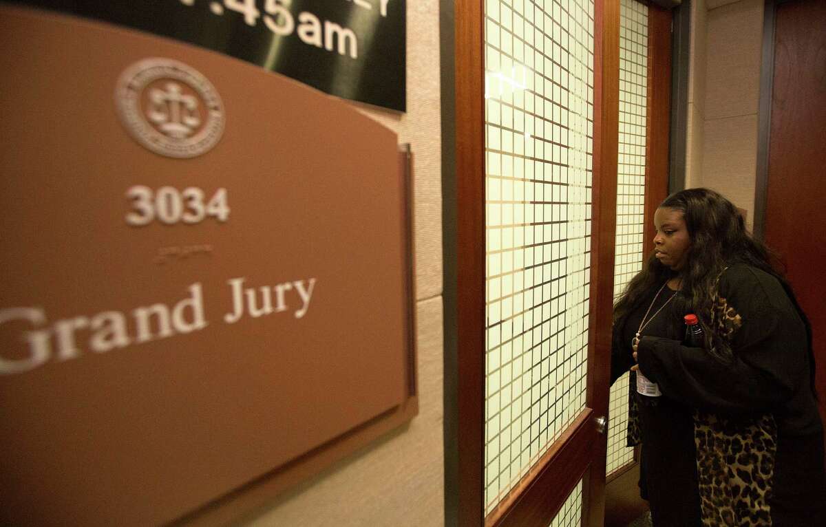 Janet Baker is seen waiting while a Harris County grand jury deliberated the case involving Houston Police Department Officer Juventino Castro, who last year shot Baker's son, Jordan Baker. The grand jury cleared the officer.