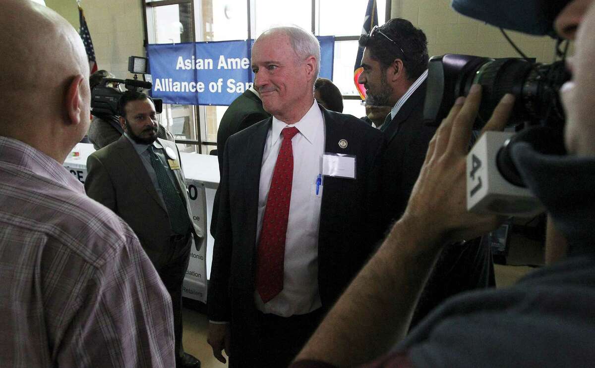 Mayoral candidate Tommy Adkisson (center) meets with guests after taking part in a mayoral forum hosted by the Asian American Alliance of San Antonio held at Churchill High School on Saturday, Feb. 7, 2015. Adkisson, including Mike Villarreal and Leticia Van de Putte, fielded questions for nearly an hour and a half to a packed room of Asian American constituents. Topics included their visions of San Antonio, potential inclusion of Asian Americans in local government and future economic goals focused on local private business. (Kin Man Hui/San Antonio Express-News)