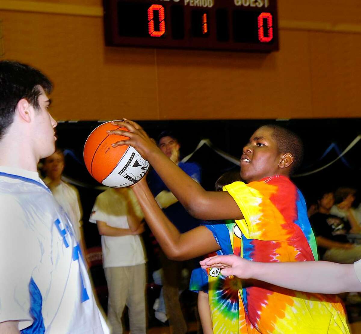 Stamford Black Knight, Elijah Sinclair, in action during the Unified Sports Basketball Tournament at St. Luke's School in New Canaan.