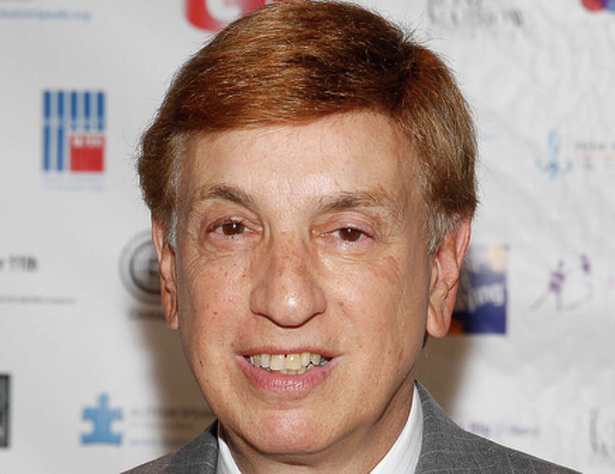 FILE - In this Sept. 11, 2013 file photo, Marv Albert arrives at the Annual Charity Day hosted by Cantor Fitzgerald and BGC Partners, in New York. A woman who said Friday, Dec. 5, 2014, that Bill Cosby had drugged her and sexually assaulted her in 1979 also accused another famous man of attempted sexual assault: sportscaster Albert, who pleaded guilty to assault and battery the day after her surprise testimony against him. (Photo by Mark Von Holden/Invision/AP, File)