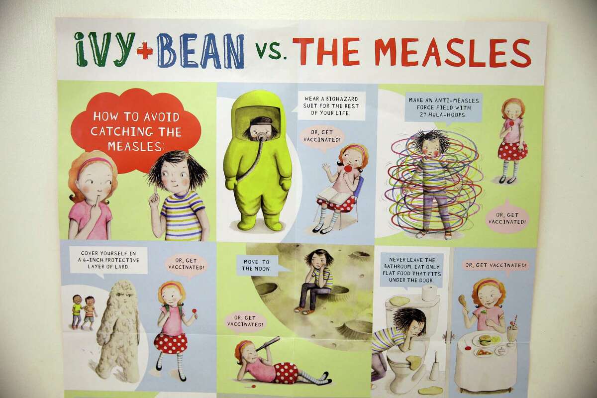 A poster educating parents and children about measles is displayed at the Tamalpais Pediatrics clinic Friday, Feb. 6, 2015, in Greenbrae, Calif. (AP Photo/Eric Risberg)