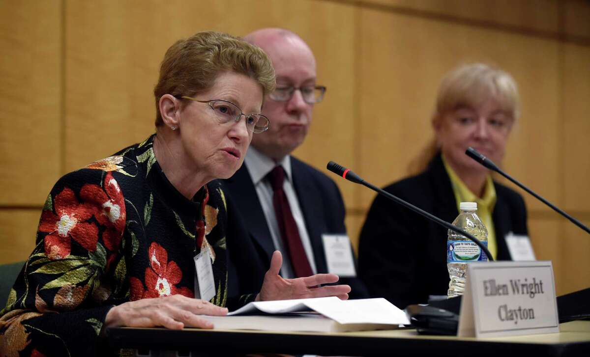 In Washington, panel chairwoman Dr. Ellen Wright Clayton details findings in the Institute of Medicine report while committee member Peter Rowe and Lucinda Bateman listen.