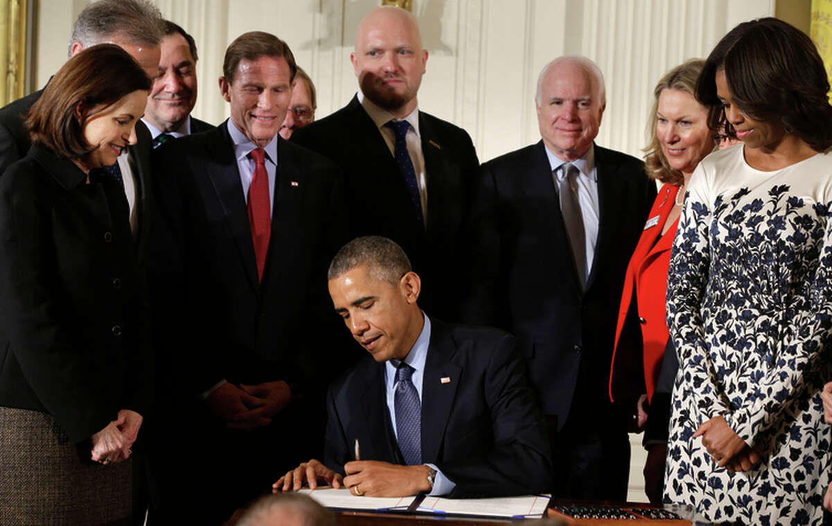 President Obama signs the bill, which named after former Marine Clay Hunt, killed himself in 2011.