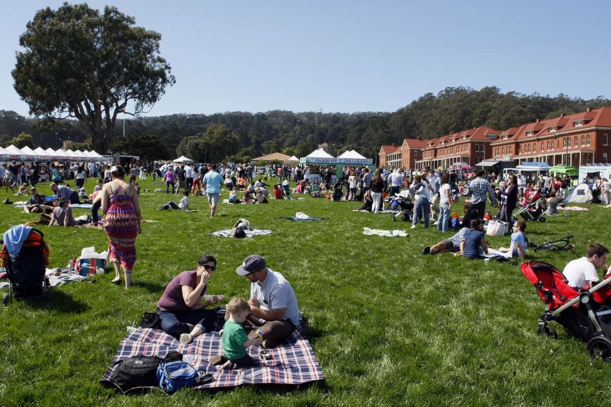 People of all ages gather to enjoy the sunshine during the kick off of Off the Grid's "Picnic at the Presidio" on April 6, 2014 in San Francisco, Calif. Food trucks, vendors and more descend on the lawn from 11 a.m to 4 p.m. every Sunday through October.