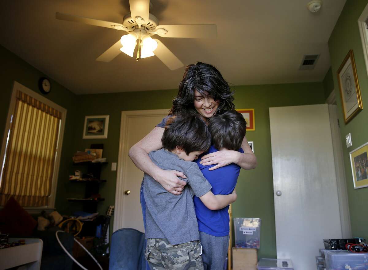 Julie Schiffman enjoys a group hug with her boys in the play room of her home Thursday February 12, 2015. Julie Schiffman is upset about the measles-crazed media mania over her comments which were misinterpreted about her home schooled children who have not been inoculated in Marin County, Calif.