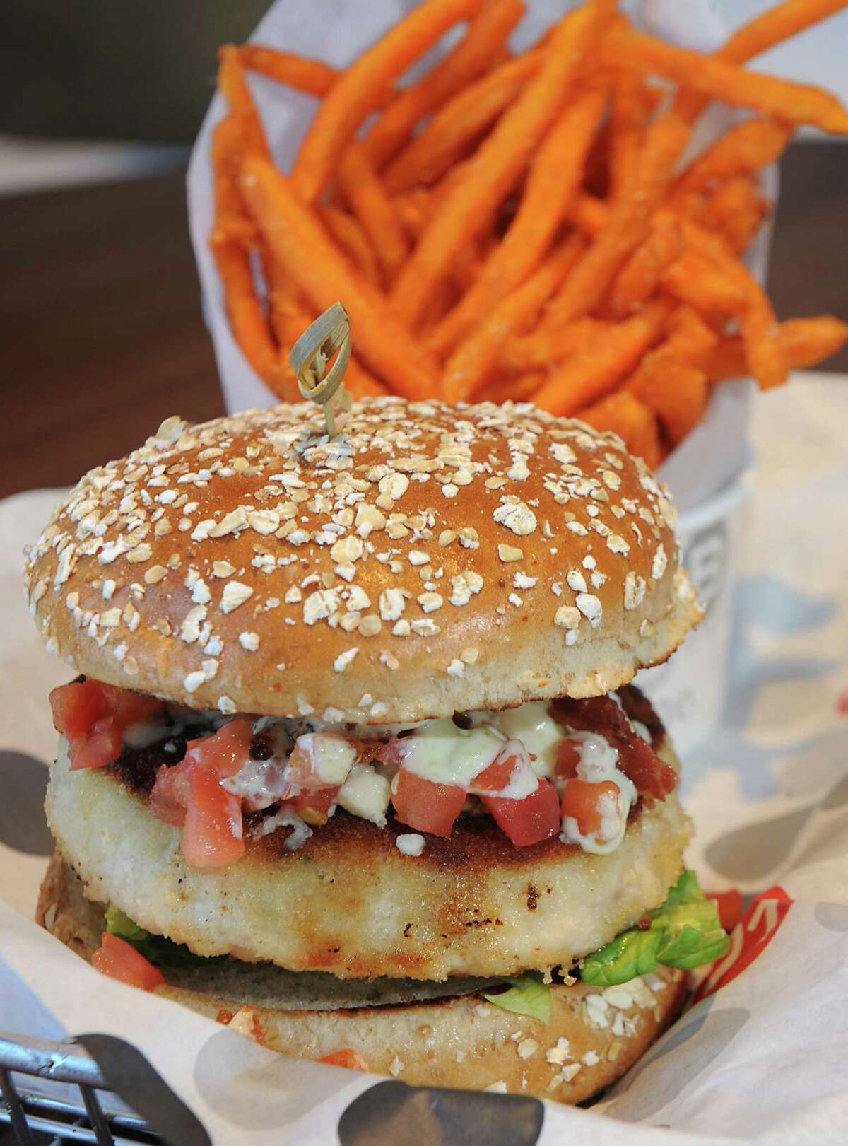 The cobb turkey burger with sweet potato fries at Burger 21 on Tuesday, Feb. 10, 2015 in Latham, N.Y. (Lori Van Buren / Times Union)