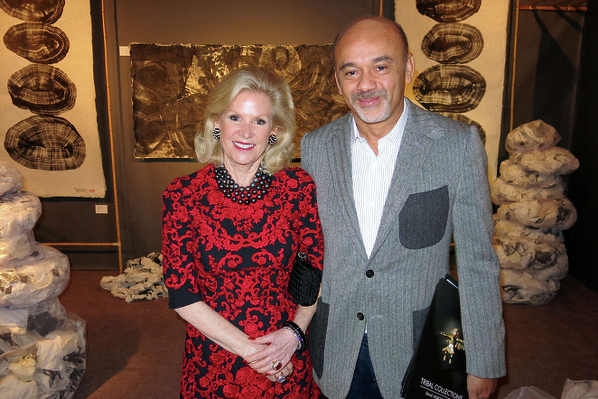 Fine Arts Museums board President Dede Wilsey and designer Christian Louboutin at the Tribal & Textile Arts Show.