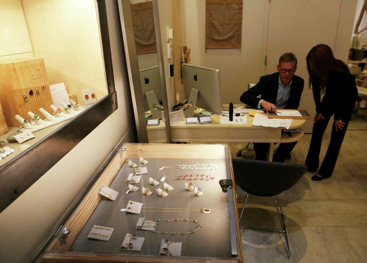 Jewelry designer Gigi Gruber and Peter Walsh, owner of Manika Jewelry, work in Walsh’s store in San Francisco on Thursday, Feb. 12. Gruber spotted Doris Payne, a notorious octogenarian jewelry thief, in the store earlier this week.