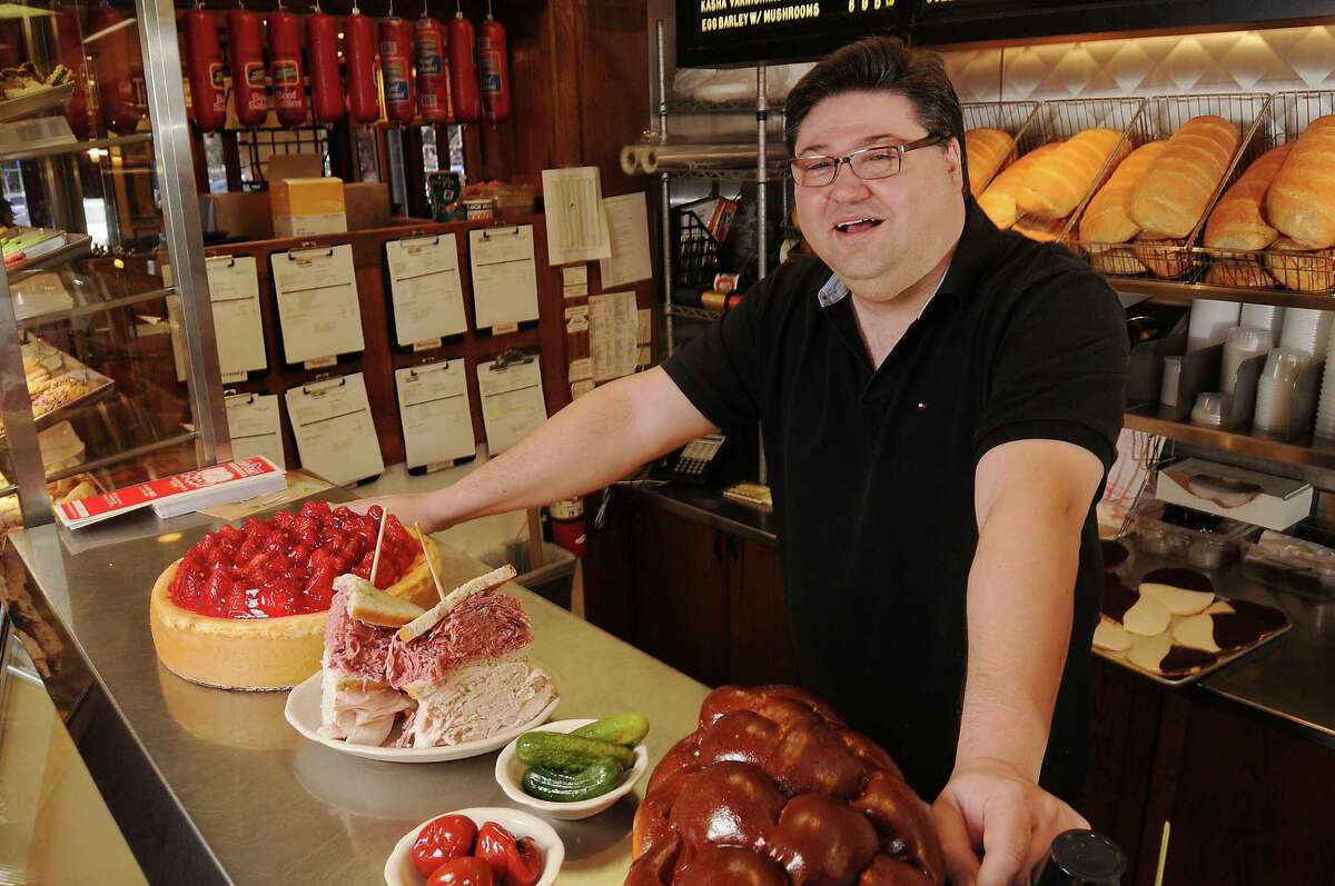 Ziggy Gruber, owner of Kenny and Ziggy's Deli, behind the counter Friday Jan. 30,2015. Gruber announced he is opening a second deli in the West University neighborhood in February 2016.