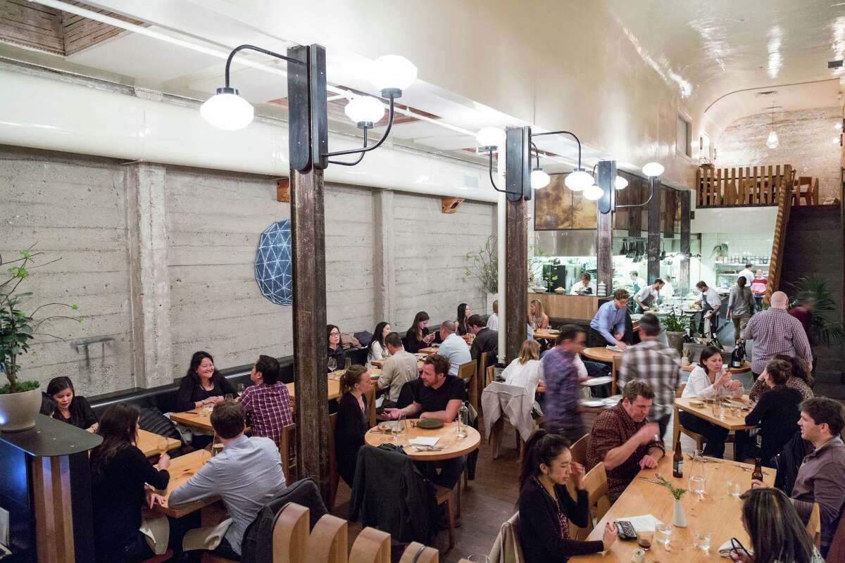 Diners eat in the main space at The Progress restaurant in San Francisco.