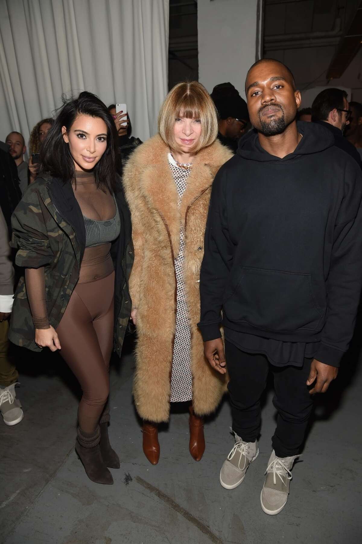 (L-R) Kim Kardashian, Anna Wintour, and Kanye West pose backstage at the adidas Originals x Kanye West YEEZY SEASON 1 fashion show during New York Fashion Week Fall 2015 at Skylight Clarkson Sq on February 12, 2015 in New York City. (Photo by Dimitrios Kambouris/Getty Images for adidas)