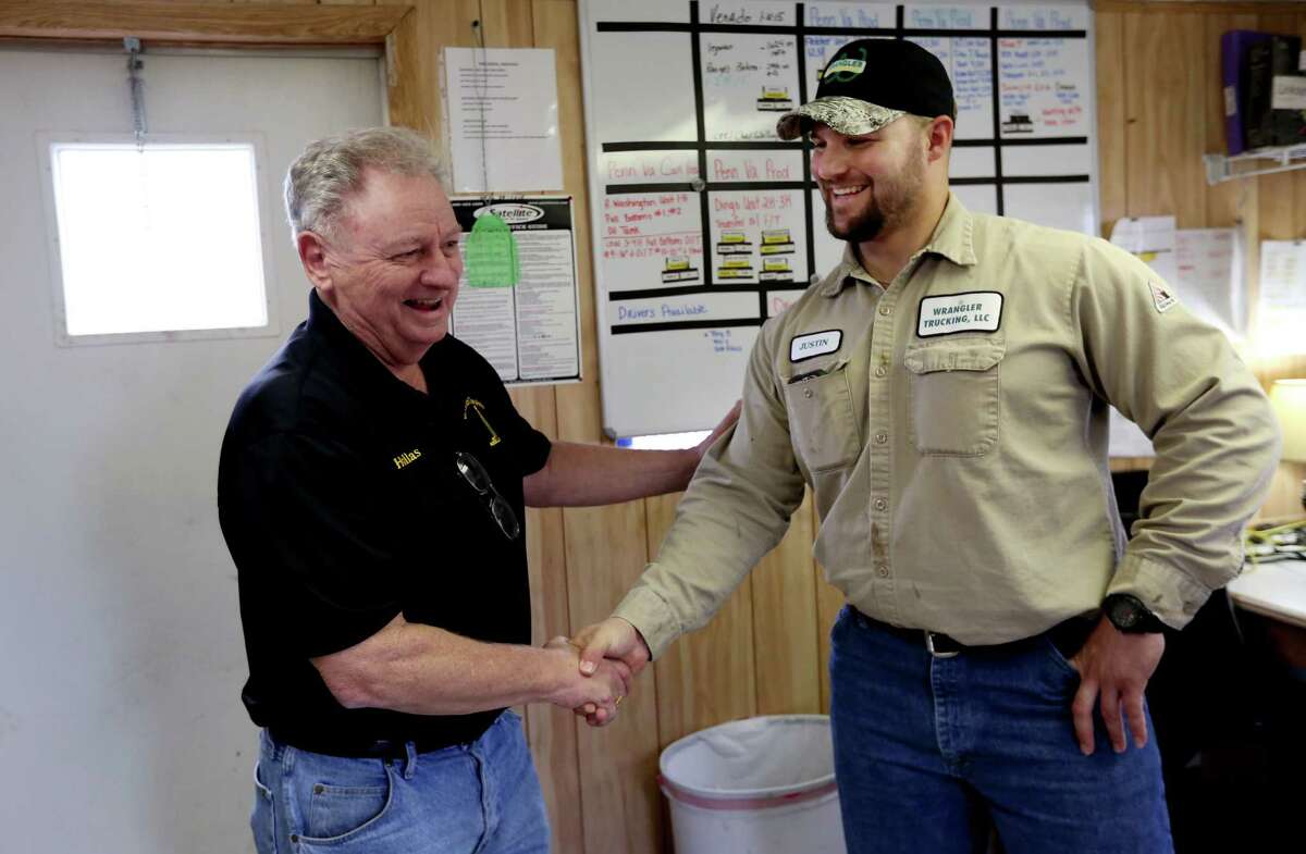 Hollas Hoffman (left), of Oil Patch Chaplains, meets with Justin Janak, fleet manager of Wrangler Trucking, to see if anyone needs any ministry earlier this month in Gonzales.
