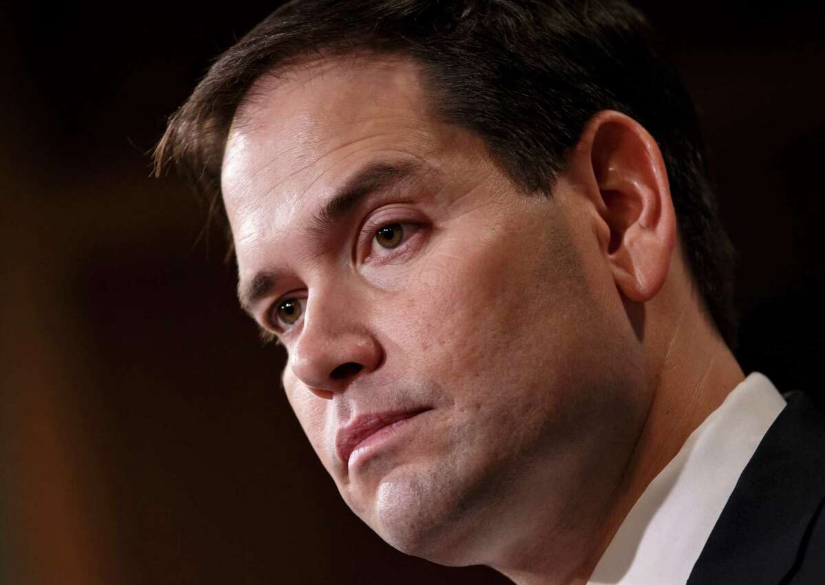 FILE - In this Dec. 17, 2014 file photo, Sen. Marco Rubio, R-Fla. speaks on Capitol Hill in Washington, Wednesday, Dec. 17, 2014. In 2002, then-Sen. Hillary Rodham Clinton took a vote in favor of the Iraq war that would come to haunt her presidential prospects. Now, a new generation of senators weighing White House bids _ Marco Rubio, Rand Paul and Ted Cruz _ will have to make a similar choice about President Barack Obama?’s use of force request. Clinton, too, will face questions about her position on Obama?’s proposal, but this time has the advantage of avoiding an actual vote on the Senate floor. (AP Photo/J. Scott Applewhite, File)