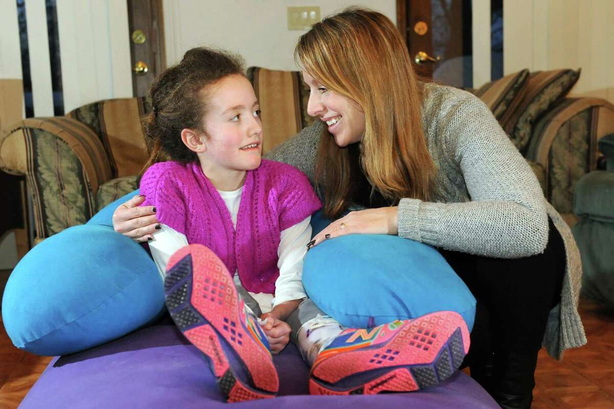 Hannah Sames, 10, left, and her mother, Lori Sames, at their home on Friday, Feb. 13, 2015, in Clifton Park, N.Y. (Cindy Schultz / Times Union)