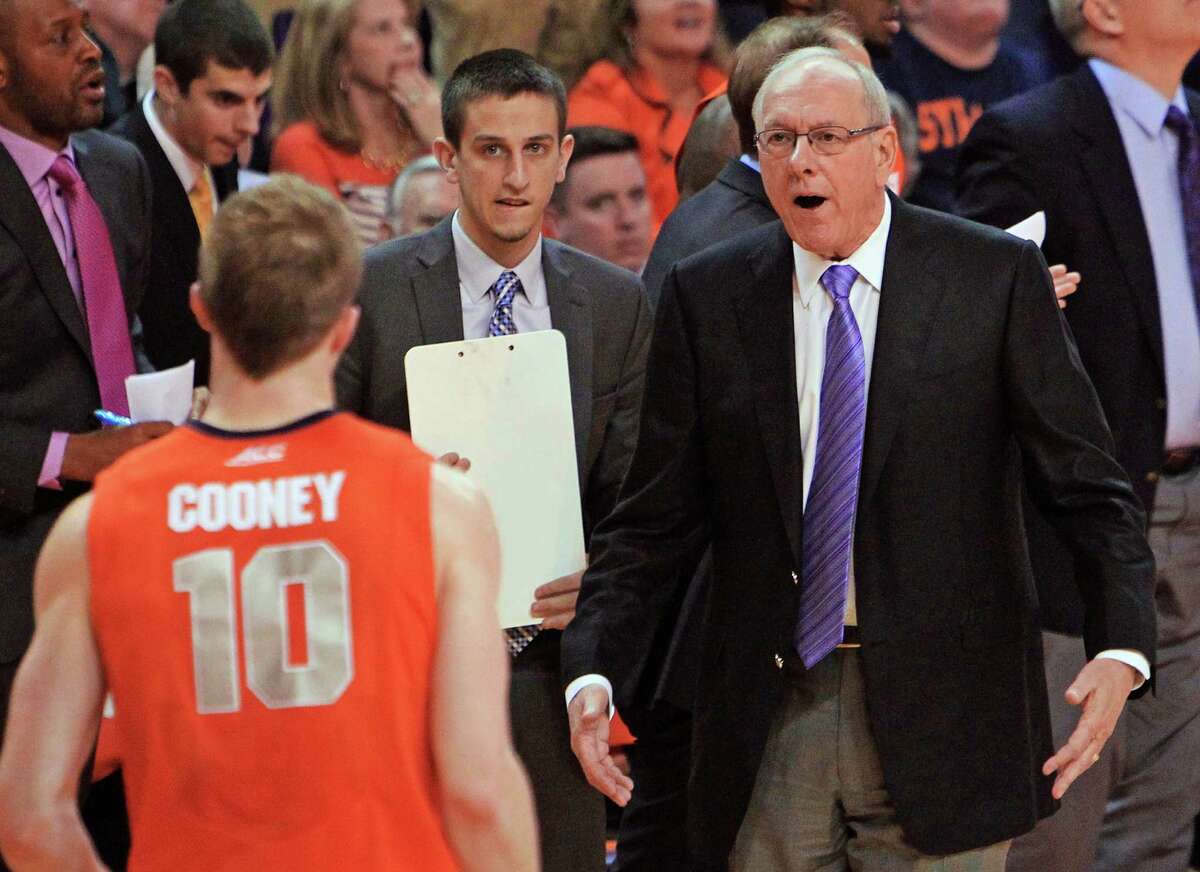 Syracuse coach Jim Boeheim, right, makes a point to Trevor Cooney during a timeout during the first half of an NCAA college basketball game against Clemson in Clemson, S.C., on Saturday, Jan. 17, 2015. (AP Photo/Anderson Independent-Mail, Mark Crammer) ORG XMIT: SCAND107