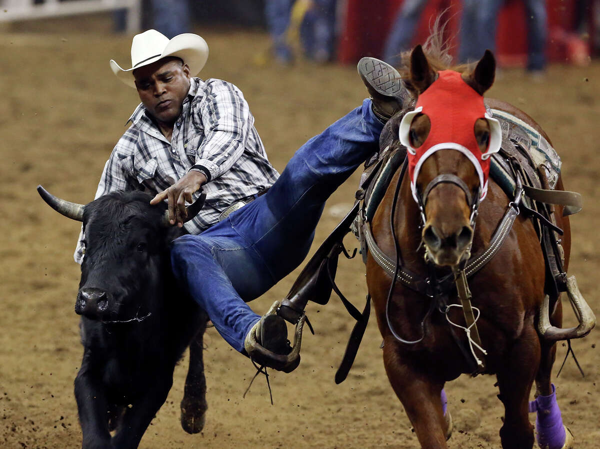 Steer wrestling at the S.A. Stock Show & Rodeo, through the years