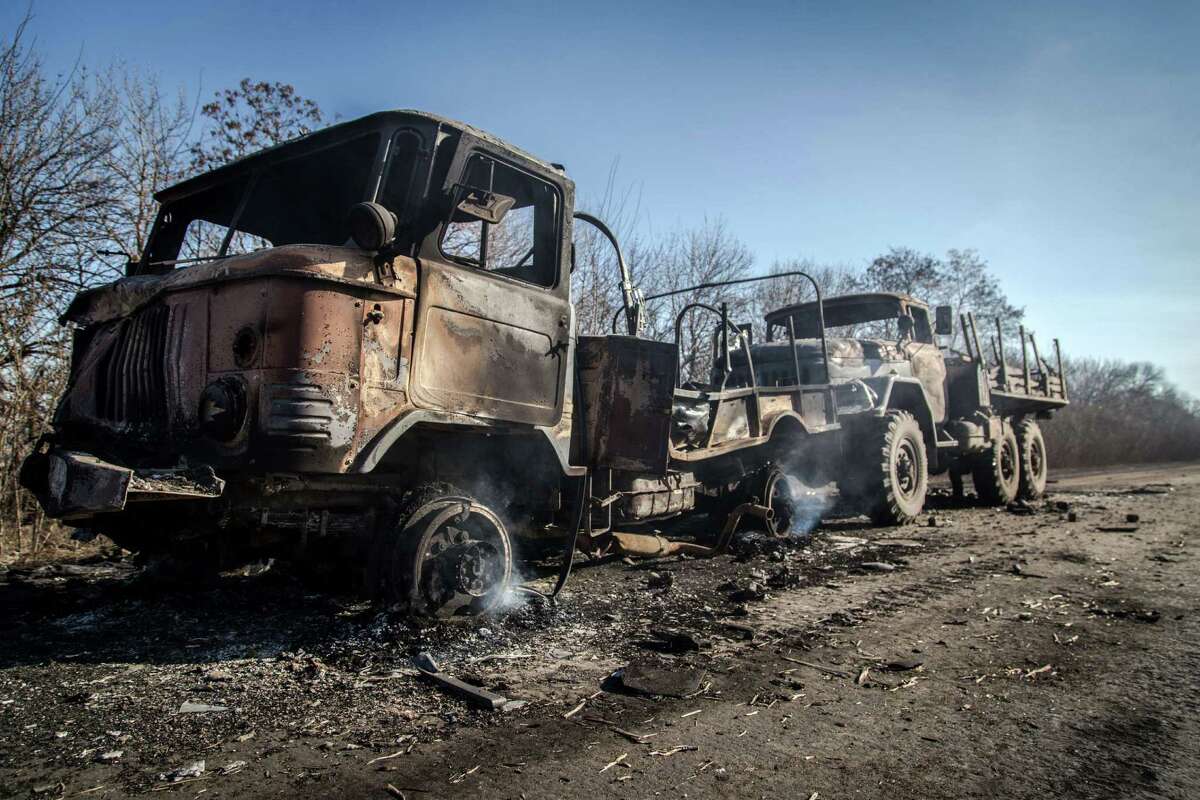 Photo shows two burned trucks of Ukrainian forces on a road not far from the village of Luganske village, Donetsk region, on February 13, 2015. Fighting raged in Ukraine on February 13 as the clock ticked down to a ceasefire that will be a first test of the commitment by Kiev and pro-Russian separatists to a freshly-inked peace plan. AFP PHOTO / OLEKSANDR RATUSHNIAKOLEKSANDR RATUSHNIAK/AFP/Getty Images