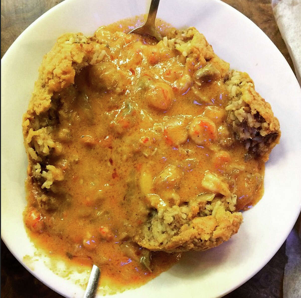 Al-T's BC Special is a deconstructed, cheese-filled fried boudin ball slathered in crawfish etouffee.