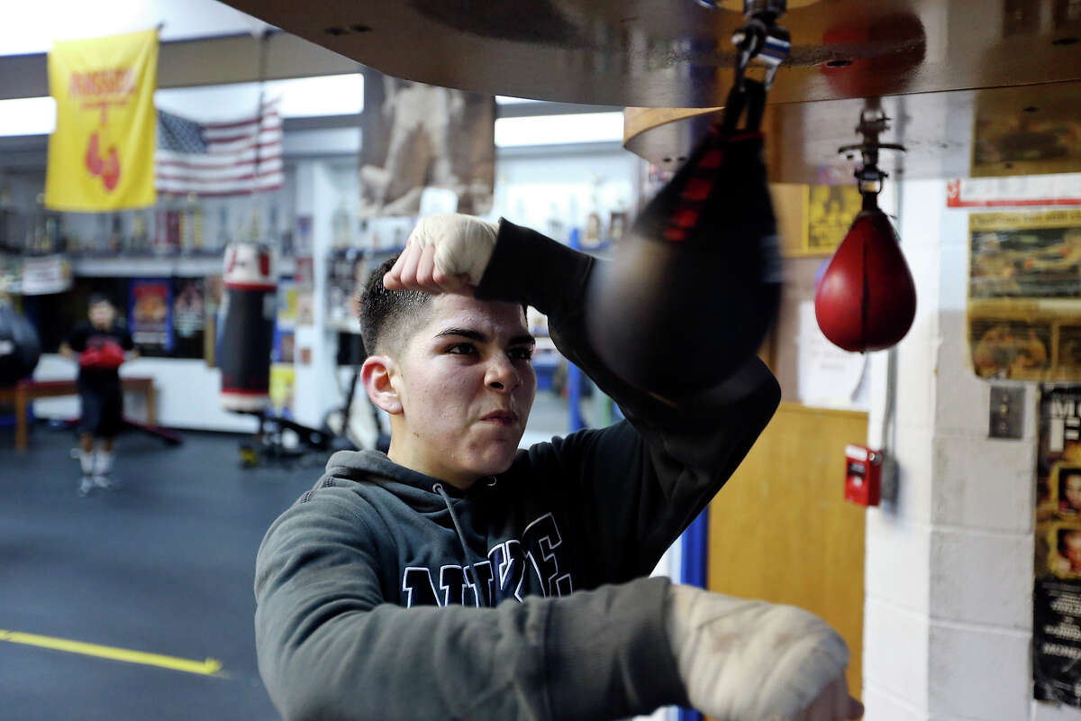 Golden Gloves boxer Joel Ochoa, 16, hits the speed bag Thursday Feb. 12, 2015 at the Calderon Boys & Girls Club.