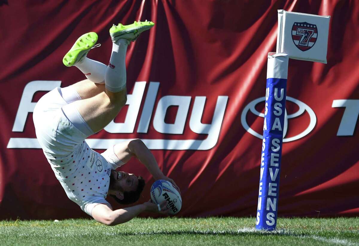 Charlie Hayter #2 of England does a summersault to score a try against France during the USA Sevens Rugby tournament at Sam Boyd Stadium.