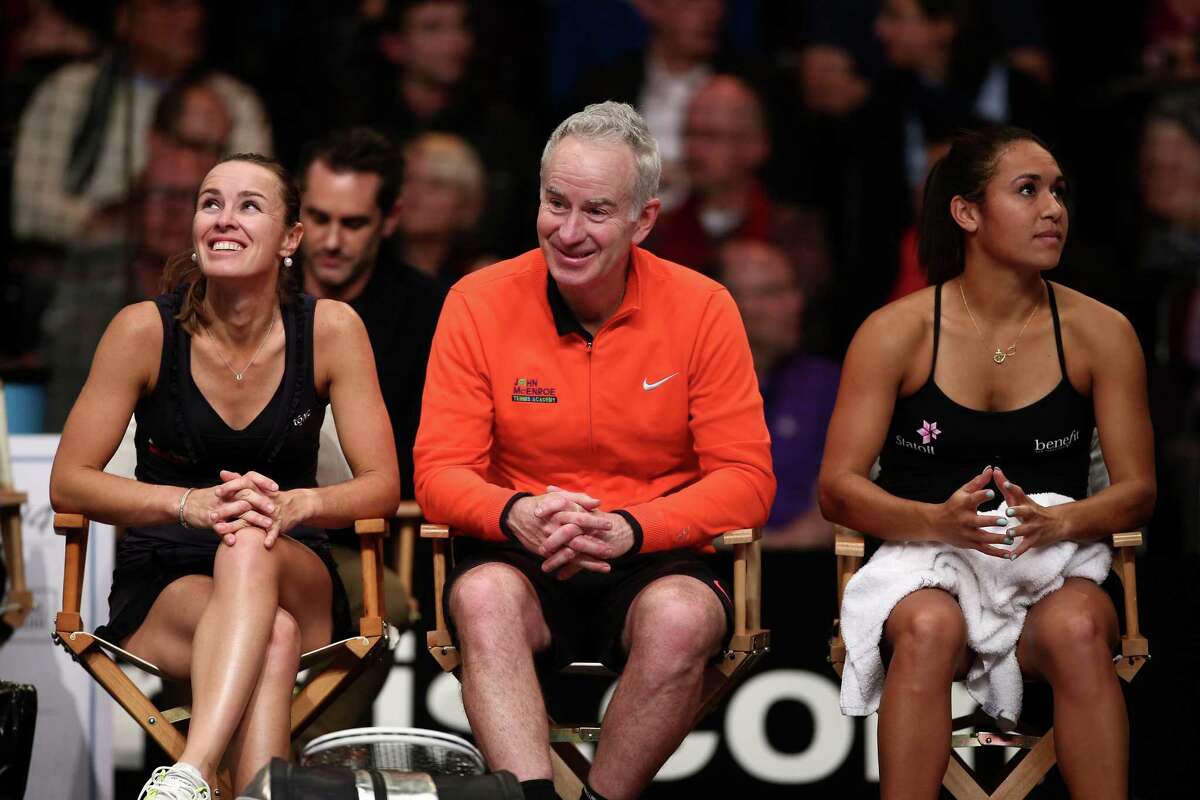 LONDON, ENGLAND - DECEMBER 07: John McEnroe (C) sits with Martina Hingis (L) and Heather Watson (R) during the Mylan WTT Smash Hits on day five of the Statoil Masters Tennis at the Royal Albert Hall on December 7, 2014 in London, England. (Photo by Jordan Mansfield/Getty Images) ORG XMIT: 526242881