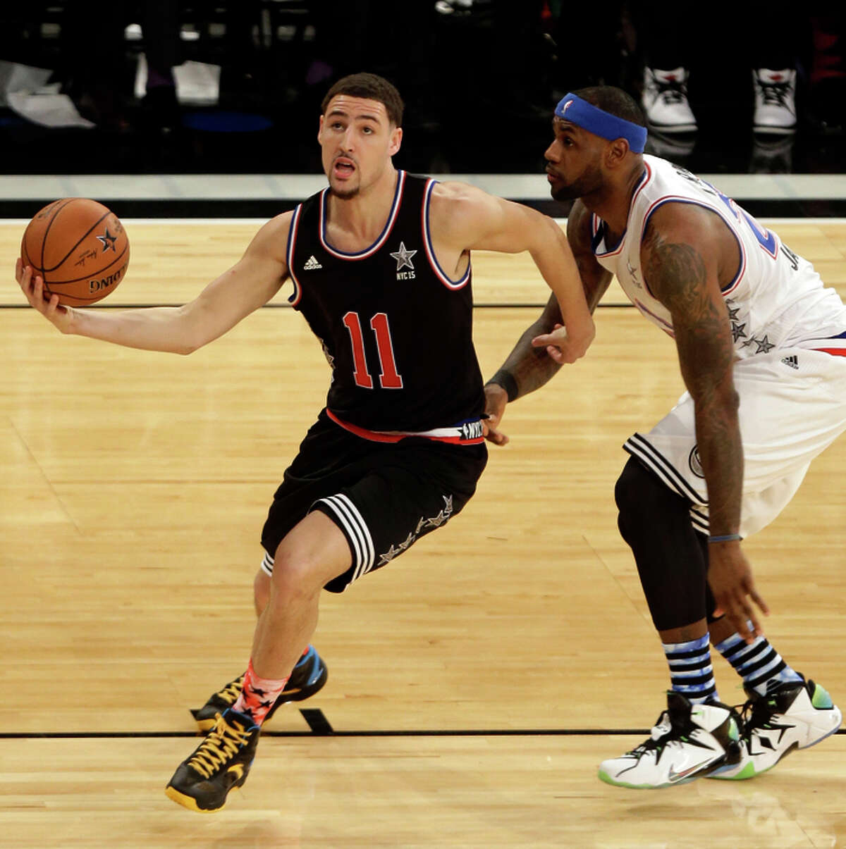 All-Star starter Klay Thompson drives past LeBron James. Thompson contributed seven points.