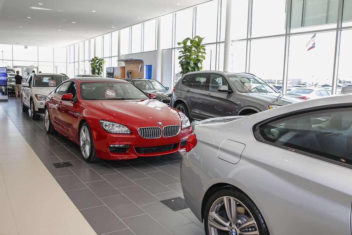 New BMW models line the inside of the showroom at BMW of West Houston, a Sonic Automotive dealership, in this file photo from Feb. 14, 2015.