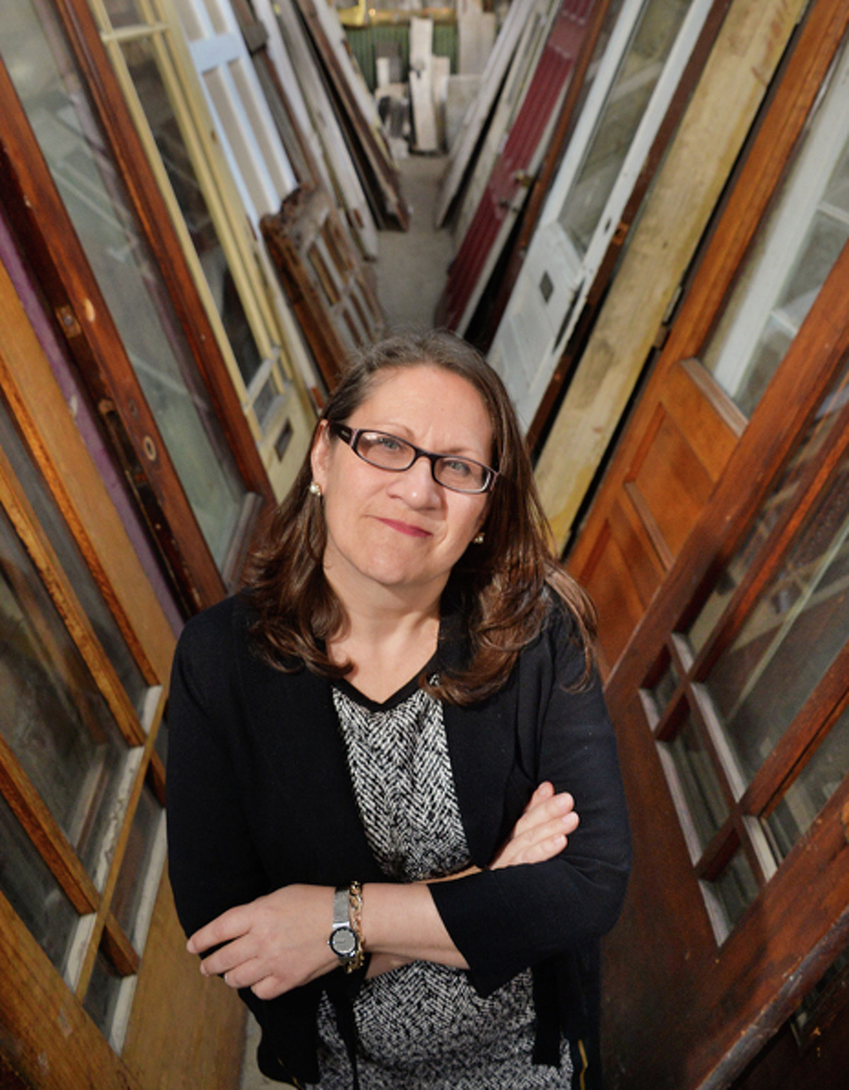 Executive director Susan Holland in an aisle of premium doors in Historic Albany Foundation's warehouse Tuesday Jan. 13, 2015, in Albany, NY.